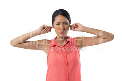 Woman covering her ears