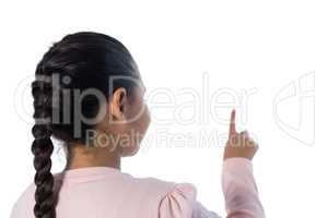 Girl pressing an invisible screen against white background