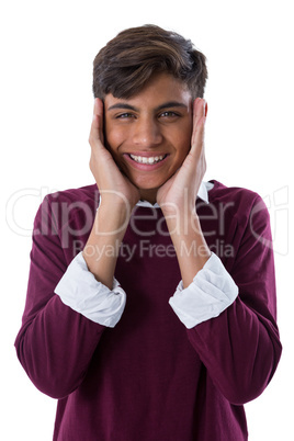 Teenage boy standing against white background