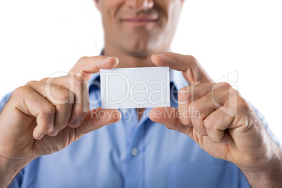 Male executive holding a blank business card