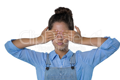 Teenage girl covering her eyes