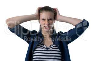 Frustrated teenage girl scratching her head