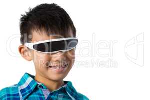 Boy using virtual reality glasses against white background