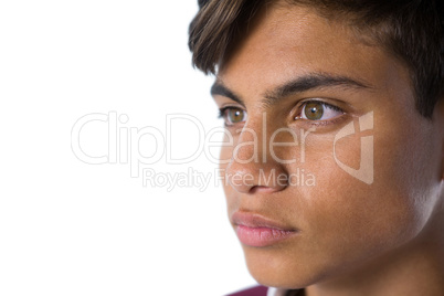 Teenage boy standing against white background