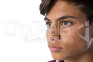 Teenage boy standing against white background