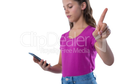 Teenage girl gesturing while using mobile phone