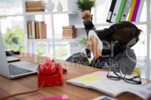 Boy as business executive using virtual reality headset