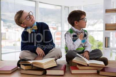 Kids as business executive sitting on a table