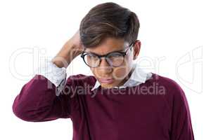 Teenage boy standing against white background