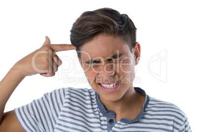 Teenage boy making gun gesture with his hand