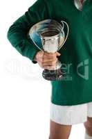 Cropped image of woman with rugby ball and trophy