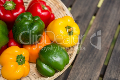 Fresh bell peppers in wicker basket