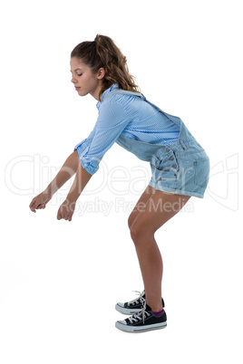 Teenage girl pretending to be holding invisible object