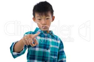 Boy pretending to touch an invisible screen