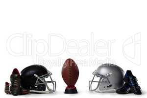 American football on tee by sports shoes and helmets