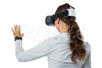 Female executive using virtual reality headset