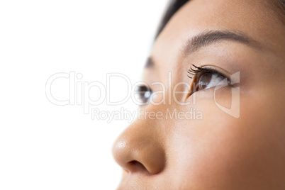 Womans eye and nose against white background