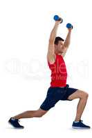 Side view of sports player exercising with dumbbells