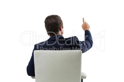 Businessman pressing an invisible virtual screen