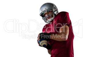 Sportsman wearing helmet while playing American football