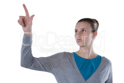 Teenage girl pressing an invisible virtual screen