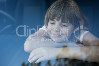 Teenage girl sitting in the car