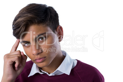 Teenage boy standing against white background