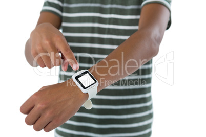 Teenage boy operating his smartwatch Teenage boy operating his smartwatch