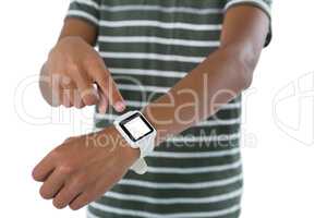 Teenage boy operating his smartwatch