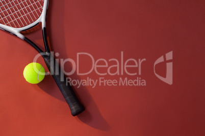 Overhead view of tennis racket and ball