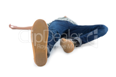 Teenage boy lying on white background