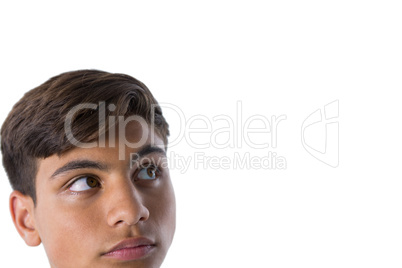 Thoughtful teenage boy looking away