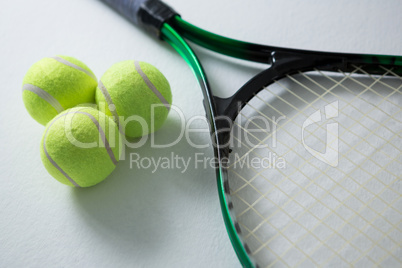 High angle view of tennis balls with racket