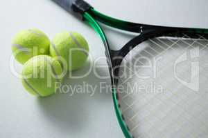 High angle view of tennis balls with racket