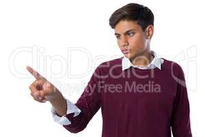 Teenage boy touching an invisible screen