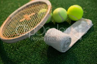 Close up of napkin with tennis balls and racket