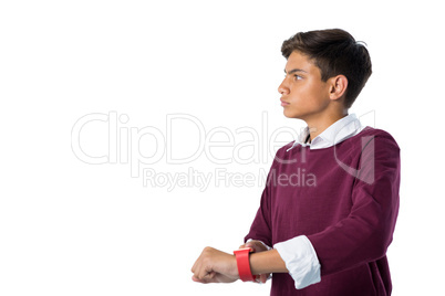 Teenage boy using smartwatch