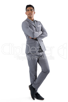 Businessman standing with arms crossed on white background Businessman standing with arms crossed on white background