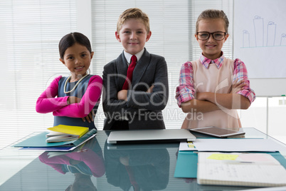 Kids as business executive smiling while standing in the office