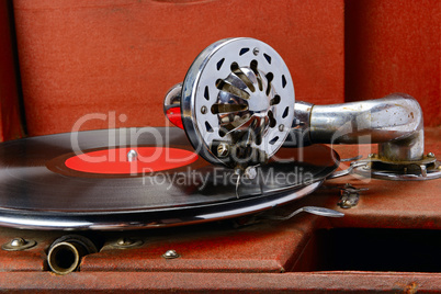 Vintage gramophone with vinyl disc. Close-up.