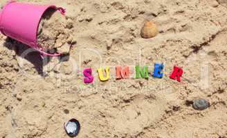 Word summer from multicolored wooden letters