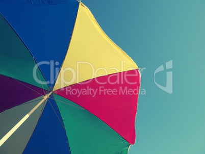 retro film stylized umbrella on blue sky