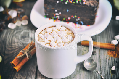 Cup with a drink and white marshmallow