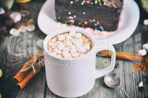 Cup with a drink and white marshmallow