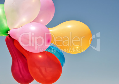 Multicolored balloons on a blue background