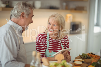 Senior couple using digital tablet