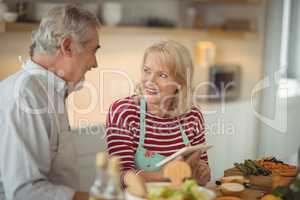 Senior couple using digital tablet