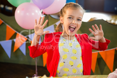 Portrait of excited girl in birthday party