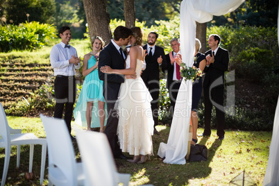 Affectionate couple kissing each other in park