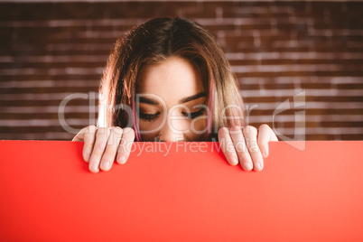 Woman looking at blank sheet